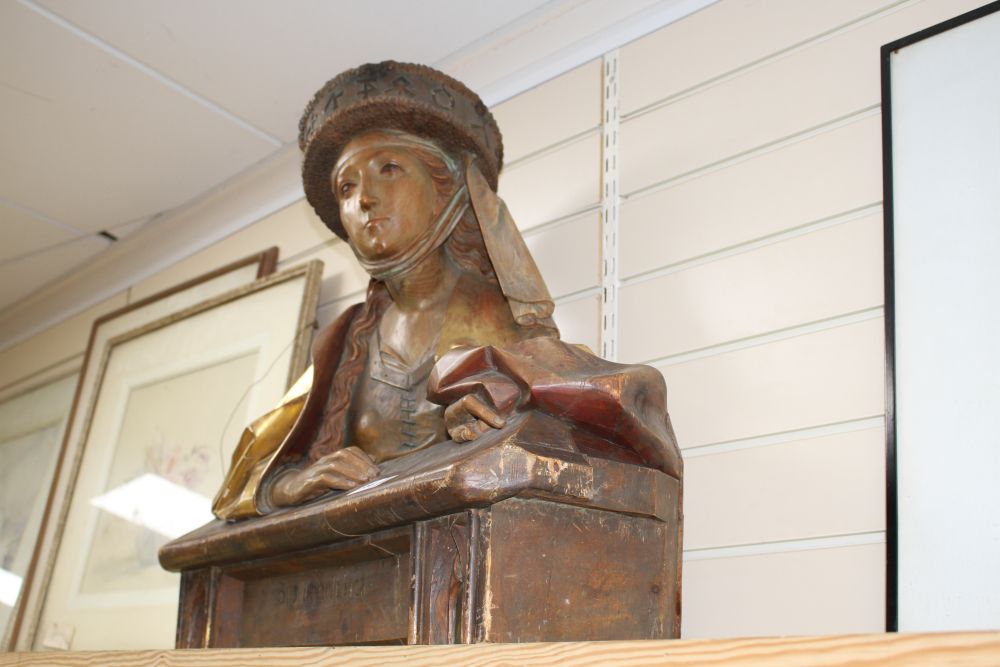 A late 19th century Black Forest carved gilt and stained pine bust of Sibilla Delphica, height 62cm width 70cm